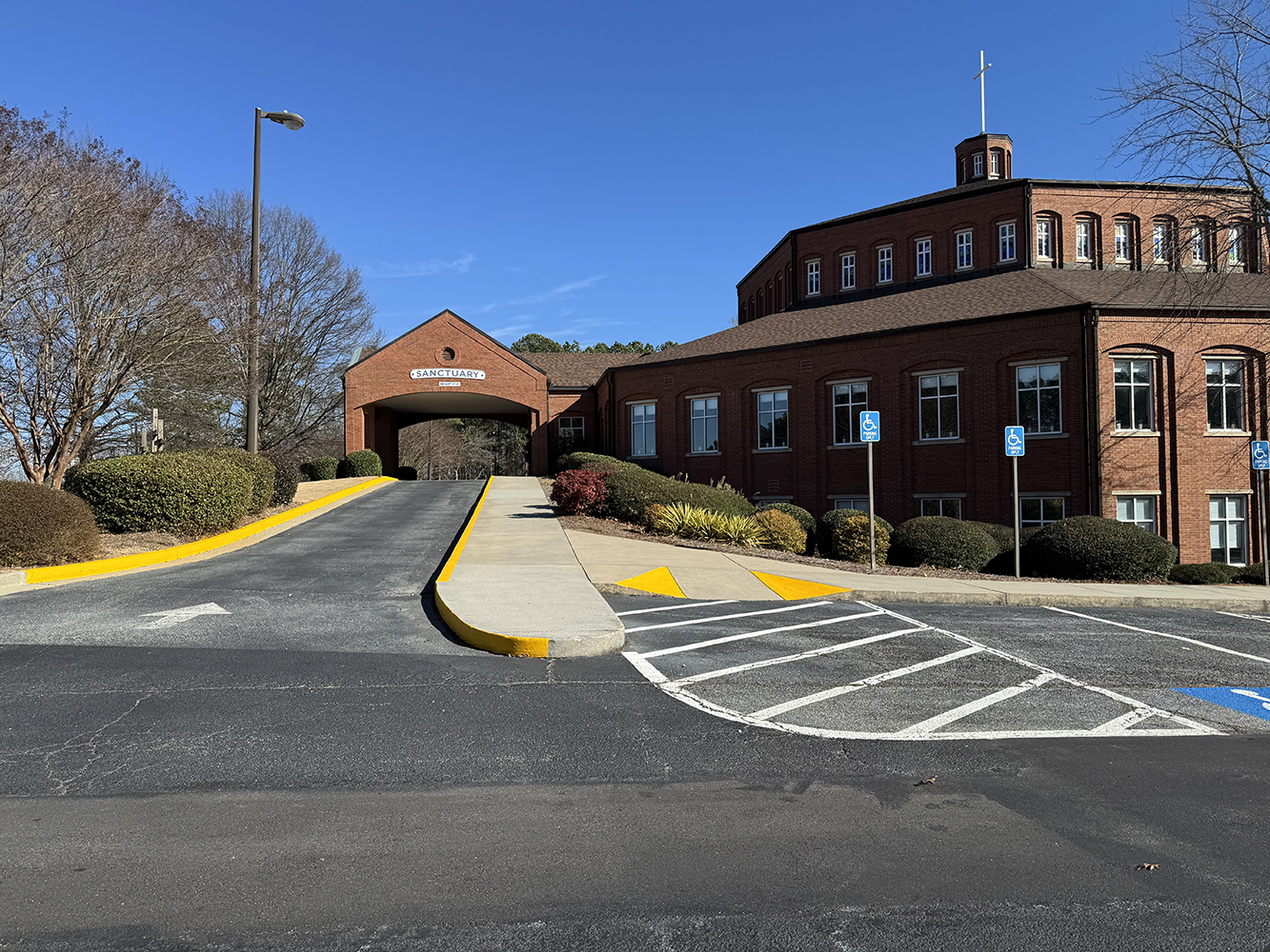 Refreshing the First Impression at a Snellville Property With Crisp Curb Painting